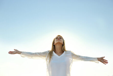 Happy young woman on sky background Happy young woman on sky background